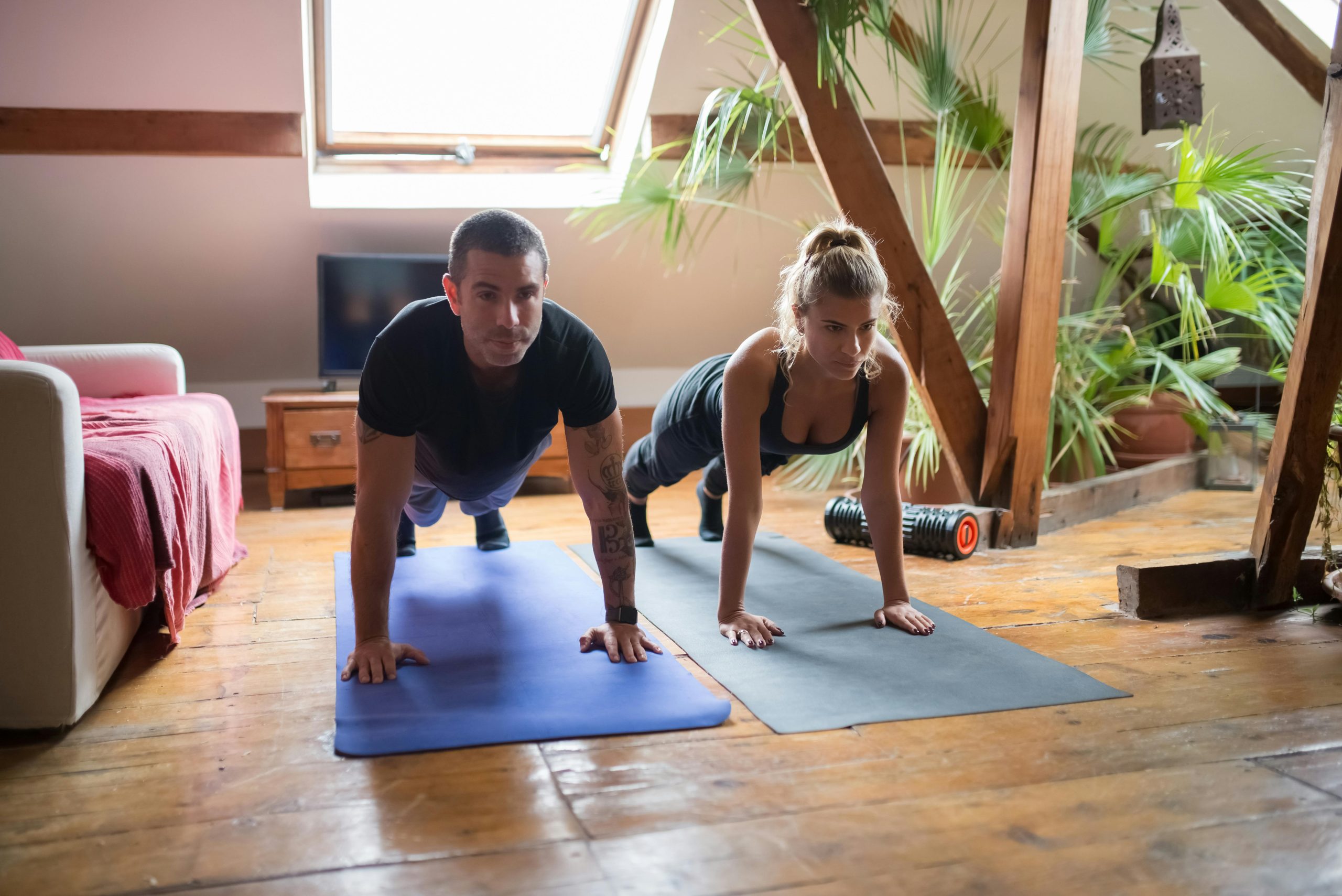 man and woman stretching